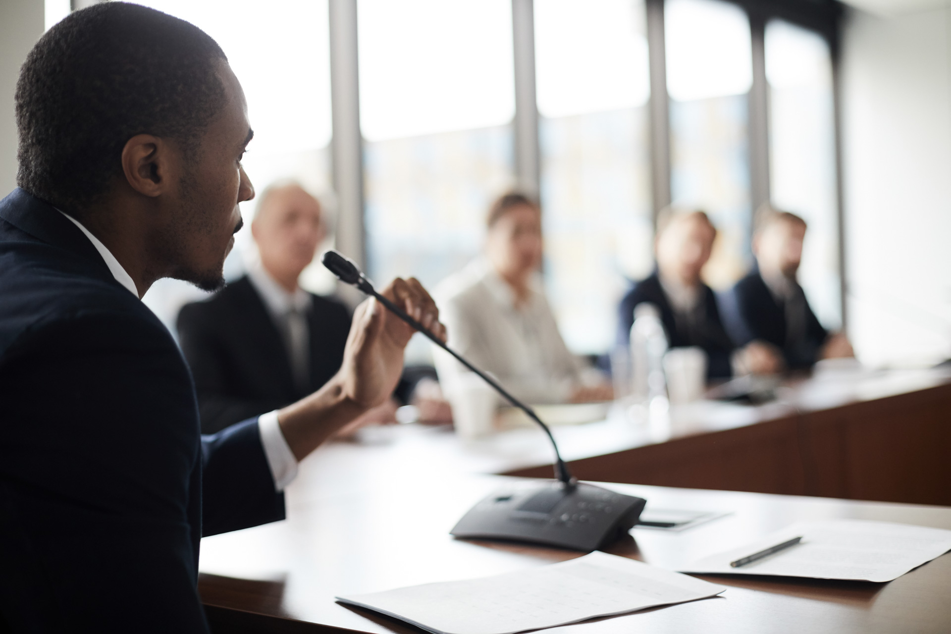 Business man speaking at a meeting