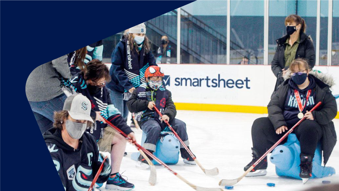 A picture of children playing on the rink for a Seattle Kraken event at Climate Pledge arena